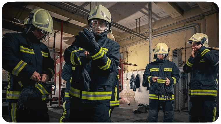 Firefighters putting on PPE