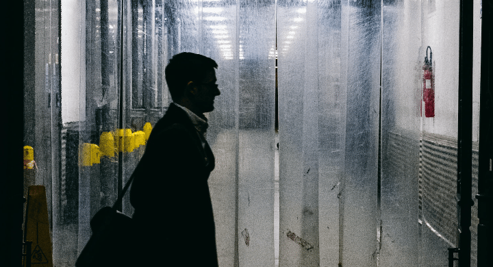 A mysterious person entering a manufacturing facility
